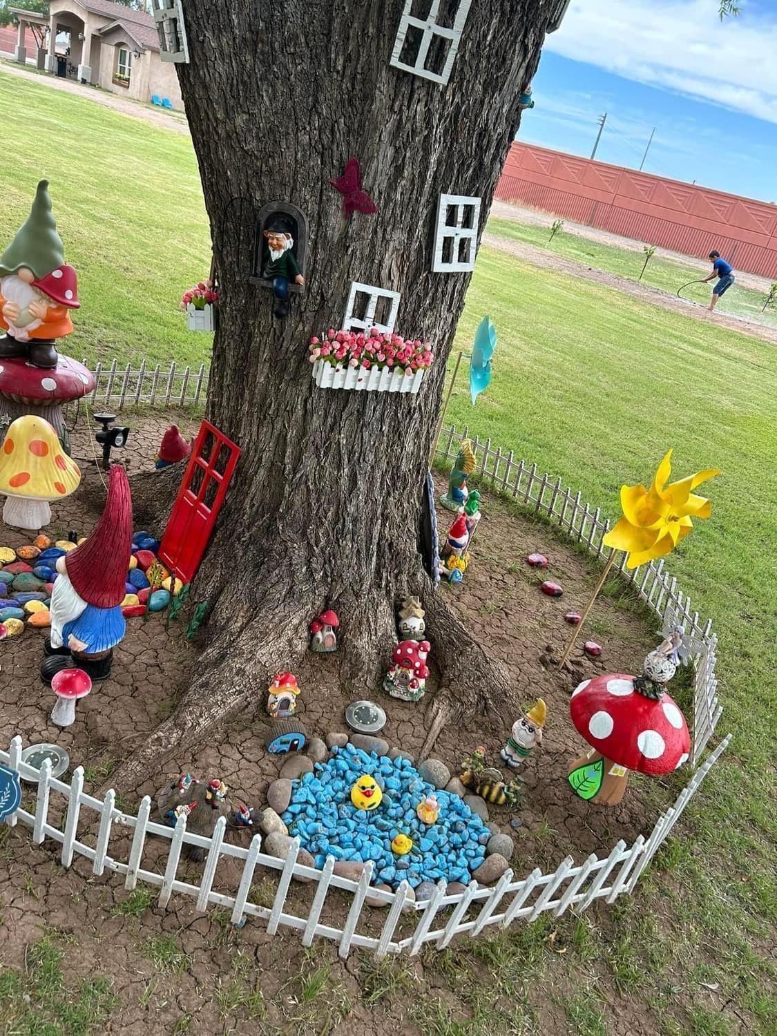 Whimsical Fairy Garden Around a Tree